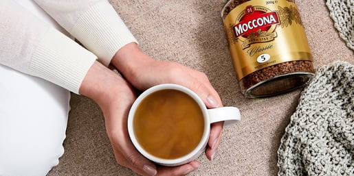 moccona hands holding cup of coffee 2